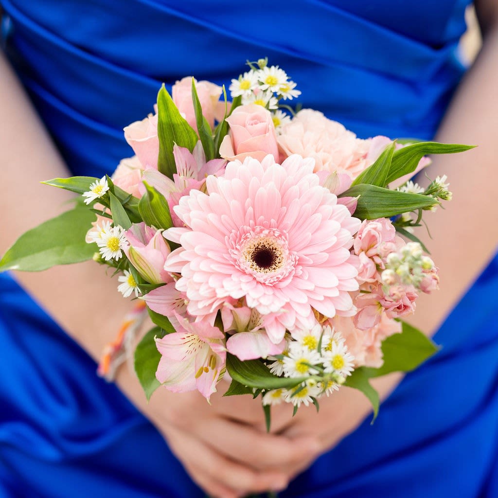 Camden - An adorable collection of blooms in a posy bouquet that includes shades of delicate pinks~ blush, bubblegum and ballet. Perfect for holding in photos!  Pick up dates for prom are Saturday, April 18th, April 25th and May 2nd. Please call if you need to order this for a different event.