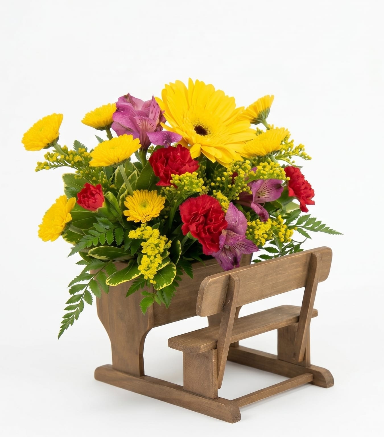 Lessons in Bloom - Celebrate the educators who help our children grow! This thoughtful arrangement features a vibrant mix of sunny yellow gerbera daisies, cheerful mums, and rich magenta carnations nestled inside a unique, vintage-style wooden school desk. It’s a beautiful way to say thank you for a wonderful school year, celebrate Teacher Appreciation Week, or simply acknowledge a mentor who makes learning a beautiful experience.