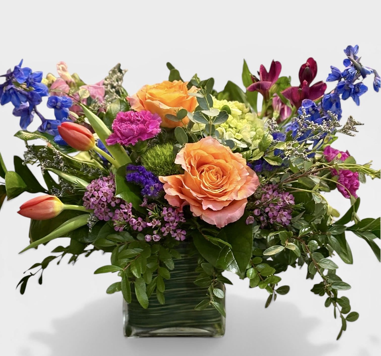 Bright and Bold - Beautiful bright and bold colors arranged in a square glass vase.