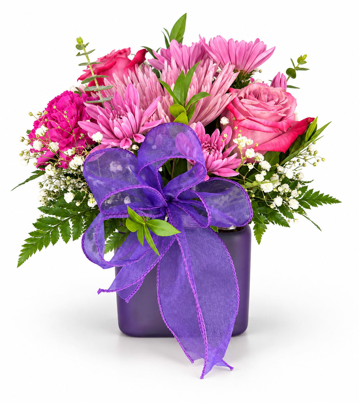 Pink and purple flower arrangement in a dark vase with a large purple ribbon