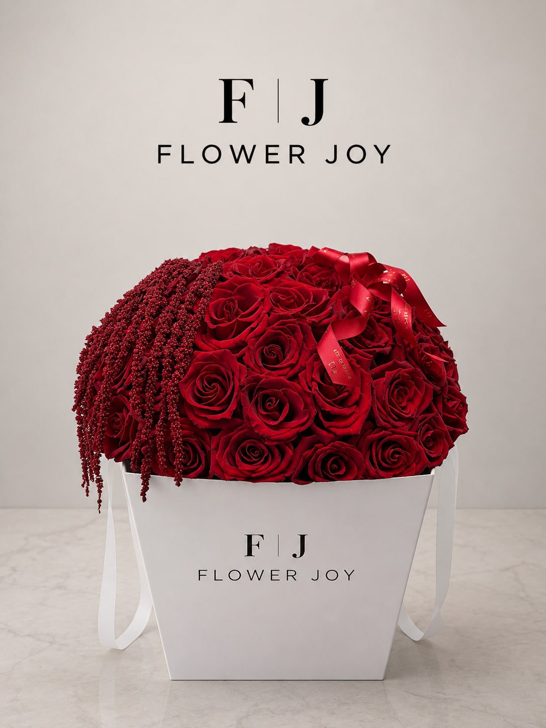 Classic Red Rose Luxury Box - A premium Flower Joy gift box filled with rich red roses, cascading red amaranthus, and elegant branded ribbon details.