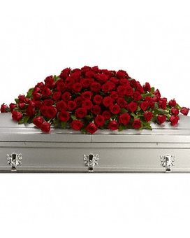 Red rose casket spray on a silver casket