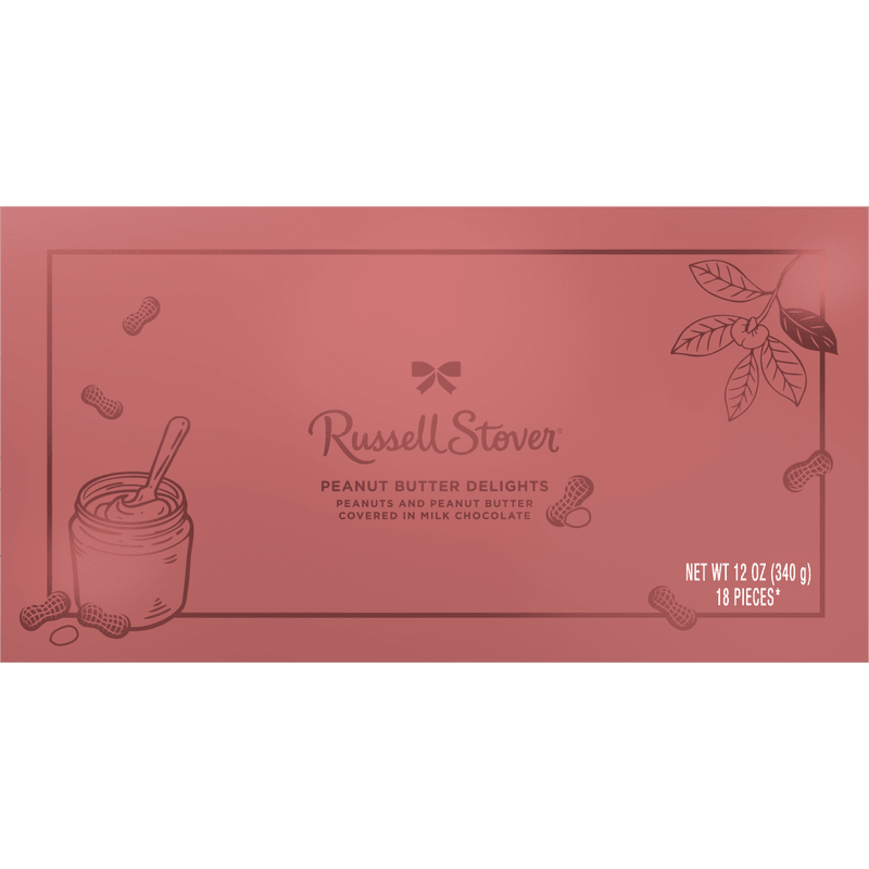 Peanut Butter Delights Russell Stover - A cheerful boxed candy makes a lovely add-on for a birthday bouquet or a sweet "thinking of you" gift - this Peanut Butter Delights Russell Stover box pairs perfectly with pink-and-white floral arrangements for Mother's Day, birthdays, or small celebrations. The pink packaging, accented with simple line drawings of a peanut butter jar and peanuts, reads as thoughtful and casual; it's the kind of little surprise that will make the person you're thinking of smile when they open it.  The box is compact and gift-ready, its clean design and centered Russell Stover logo presenting as a polished extra alongside flowers. Colors include soft pink with white and green accents, making it an easy match for romantic roses, playful tulips, or mixed-season bouquets. Use it to top a hand-tied bouquet or tuck it into a larger arrangement as a sweet finishing touch.  Ideal as an add-on for birthdays, thank-yous, or a small indulgence for someone special - she'll feel noticed and treated. The candy box ships ready to gift; pair it with one of our medium or large arrangements at checkout to create a complete present that looks and feels thoughtfully curated.
