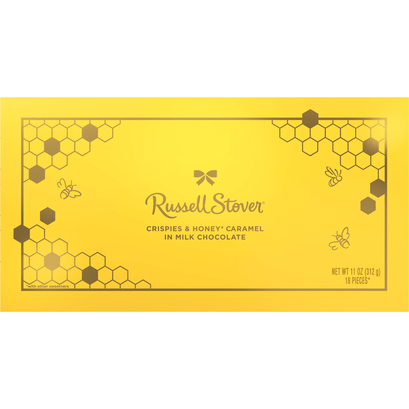 Crispies &amp; Honey Caramel In Milk Chocolate  - Sunny yellow packaging and a playful honeycomb-and-bee design make this Russell Stover Crispies &amp; Honey Caramel in Milk Chocolate box an upbeat add-on gift for birthdays, thank-yous, or casual celebrations. As a cheerful sweet treat to pair with a flower arrangement or to send on its own, it signals warmth and thoughtfulness-the kind of small surprise that makes someone smile.  The flat rectangular box features bright yellow wrapping with honeycomb accents and whimsical bee illustrations, clearly labeled with the flavor on the front. Perfect as a cross-sell gift item with bouquets, it's a convenient choice when you want to elevate a floral gift with a ready-to-gift chocolate option.