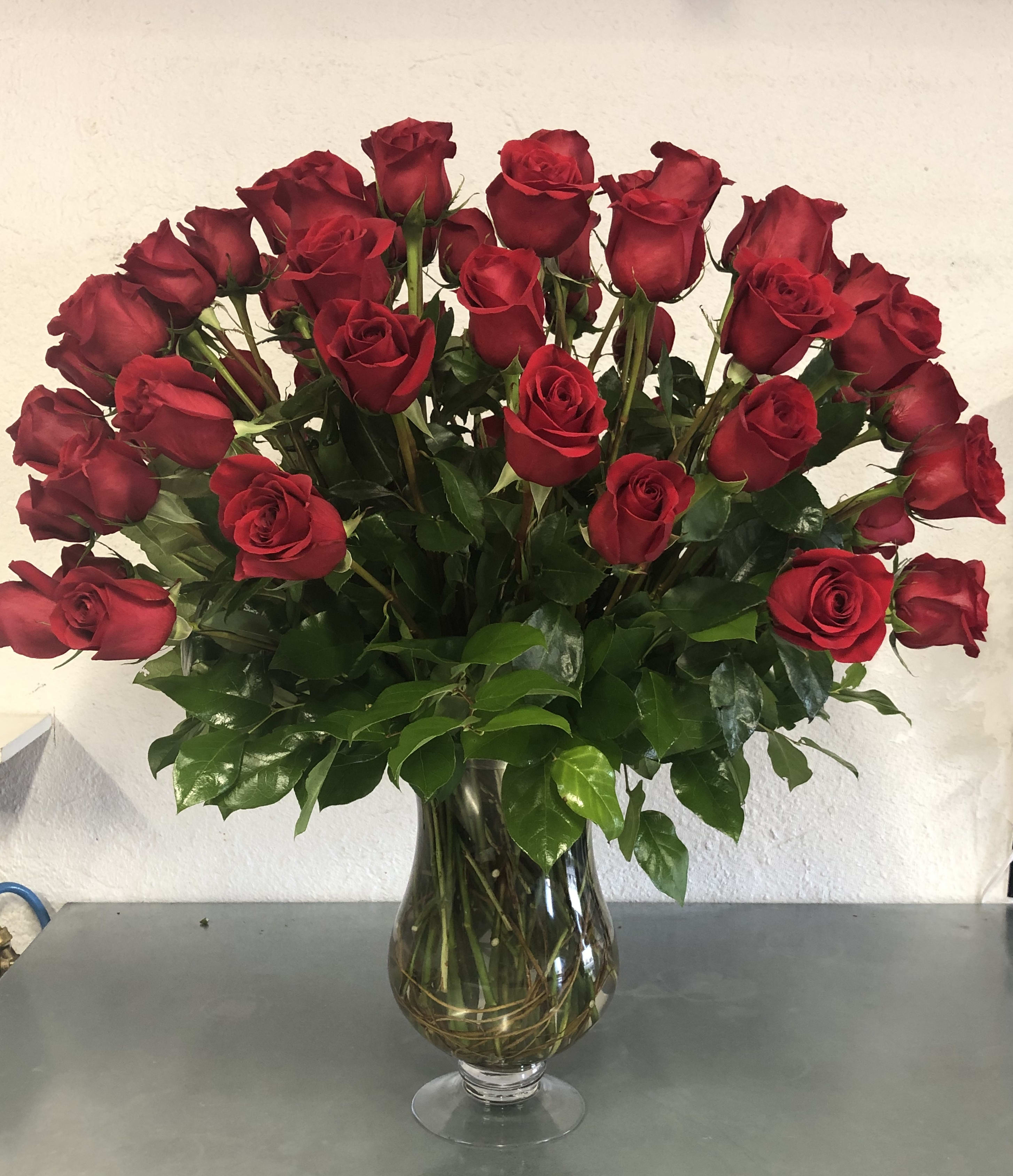 Bouquet of red roses in a clear glass vase