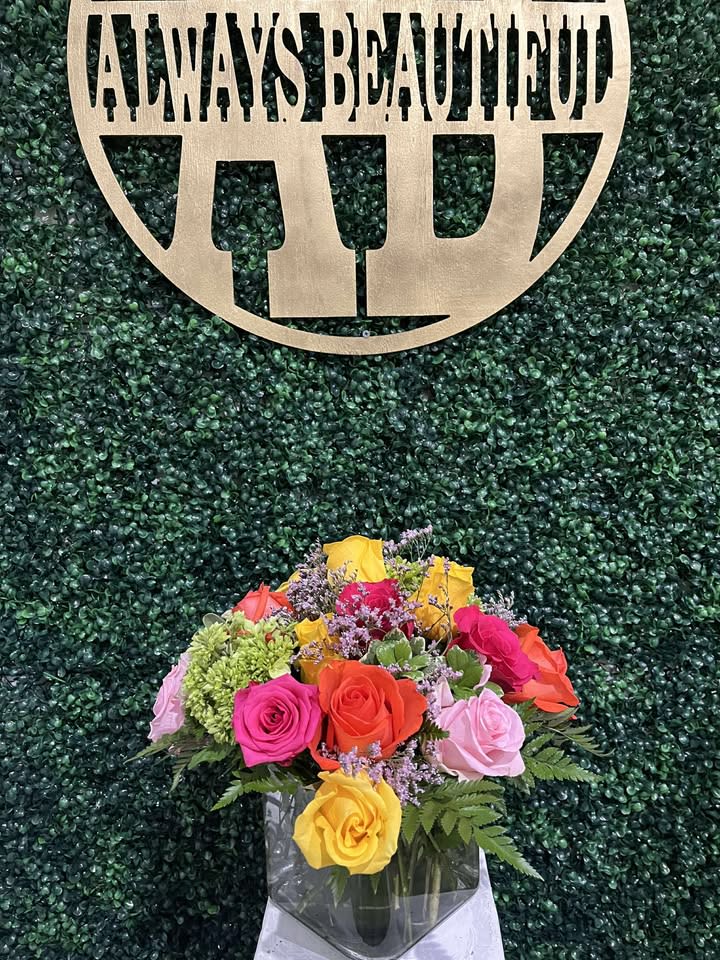 Kaleidoscope - A full-color explosion, Kaleidoscope by BloomNation™ is a beautiful gift for anybody you want to impress. Mother-in-law, your boss, a client, etc... this arrangement is a crowd pleaser and an eye-catcher.  Approximate Dimensions: 14"D x 14"H