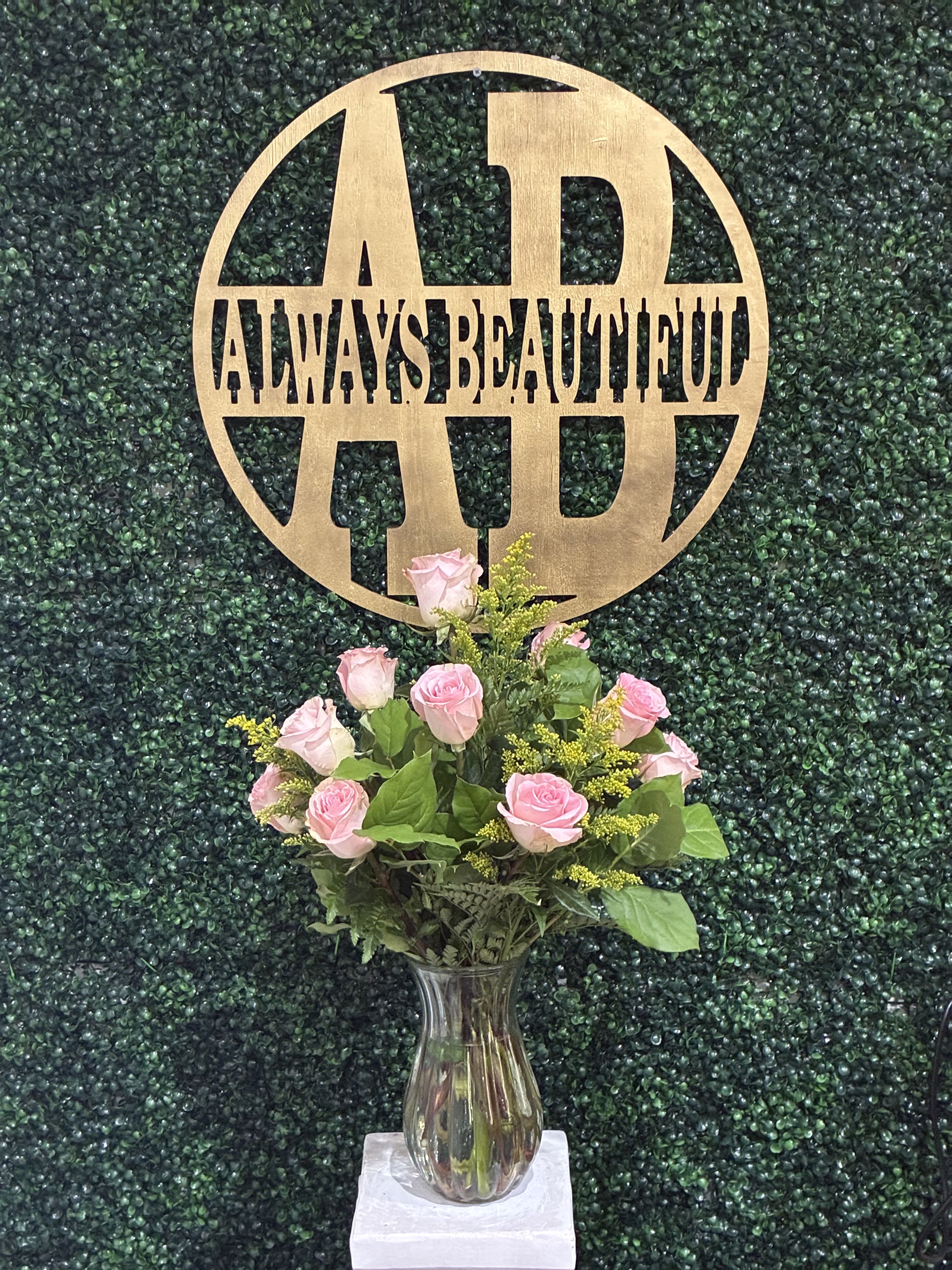 Dozen Long Stemmed Pink Roses - These pink roses are cheerful and fun! Dozen Long Stemmed Pink Roses is the perfect gift to show your love and appreciation.  APPROXIMATE DIMENSIONS: 25" H X 18" W  