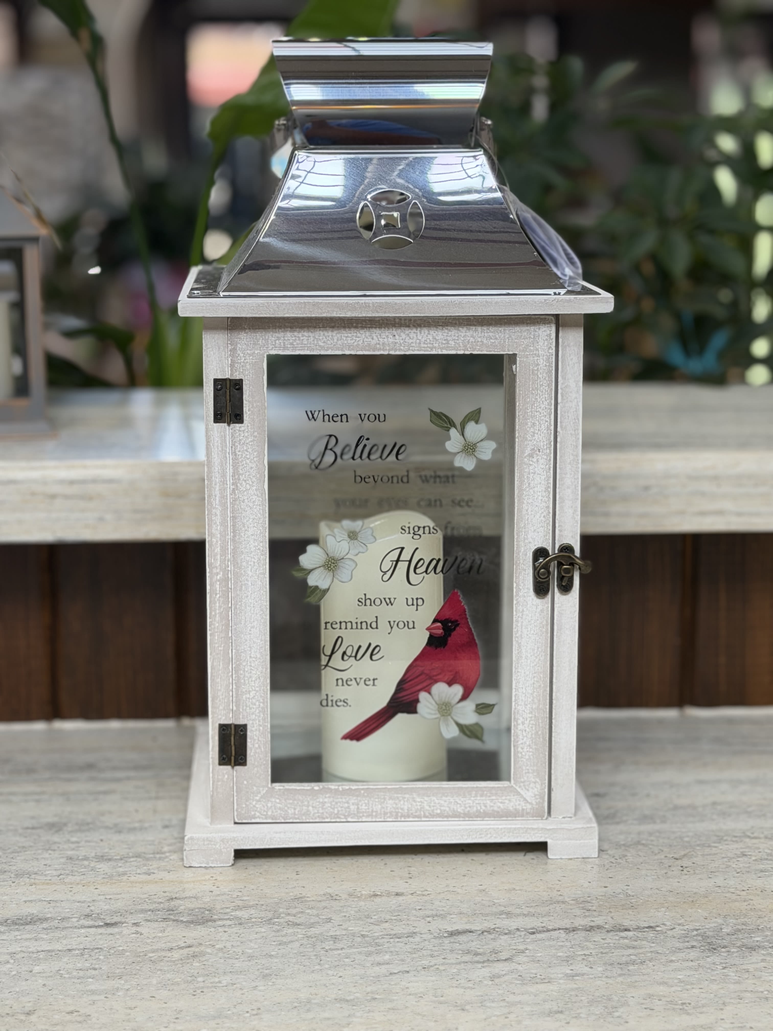 Signs From Heaven Cardinal Lantern  - A large lantern with a battery operated candle with a cardinal and flower details.  Lantern Reads: "When you believe beyond what your eyes can see, signs from Heaven show up remind you love never dies."   **Batteries Included** 