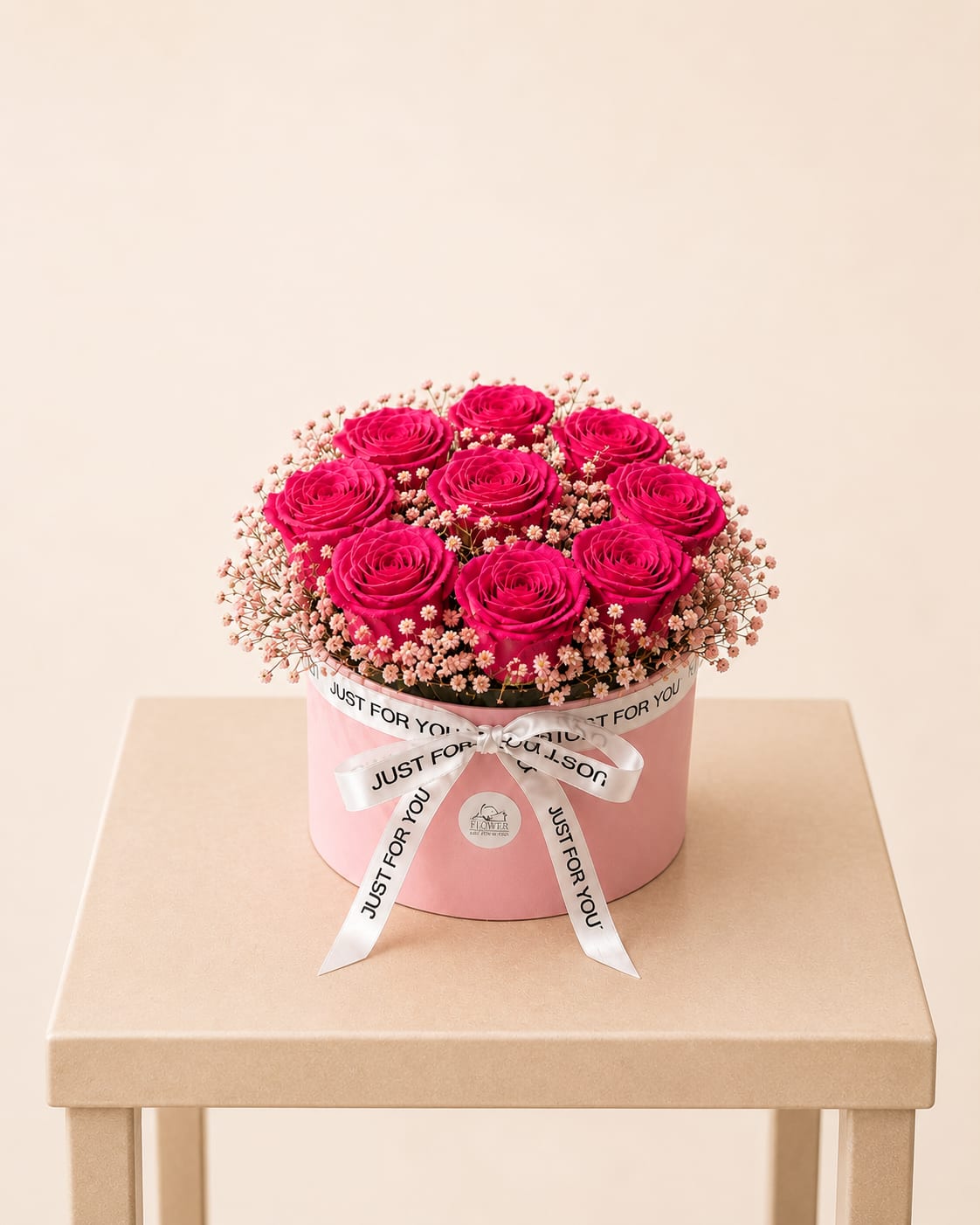 Preserved Roses in a Box - A timeless expression of love and beauty. This elegant arrangement features preserved roses in a soft pink hat box, delicately accented with baby’s breath and finished with a satin “Just For You” ribbon.  Available for local flower delivery throughout Naples, Bonita Springs, Estero, Fort Myers and Fort Myers Beach.  Designer’s Choice: Each arrangement is uniquely designed using the freshest seasonal flowers available. Flower varieties, colors and containers may vary while maintaining the overall style, value and beauty of the design.