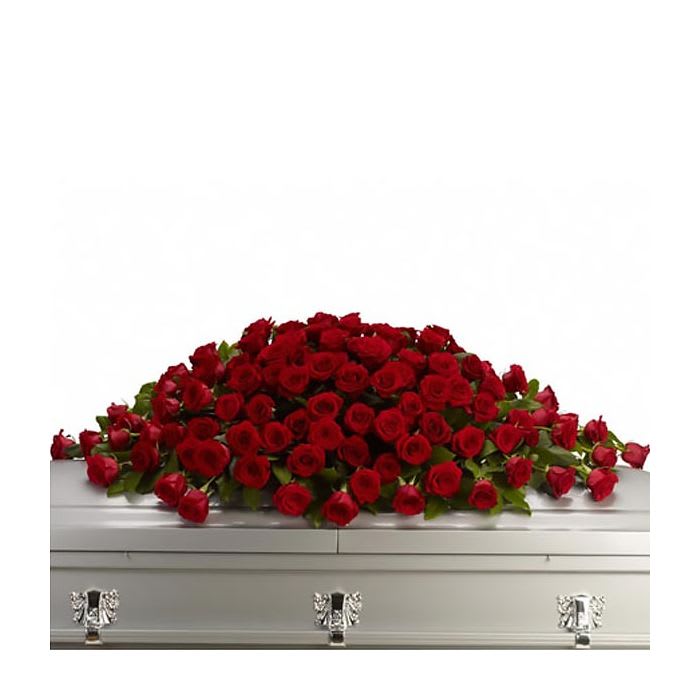 Dear Depart Casket Spary - The picture shows the premium size casket spray. The standard size includes 56 stems mixed red roses and red carnations. The deluxe size includes 90 stems mixed red roses and red carnations. The premium size includes 115 mixed red roses and red carnations.  