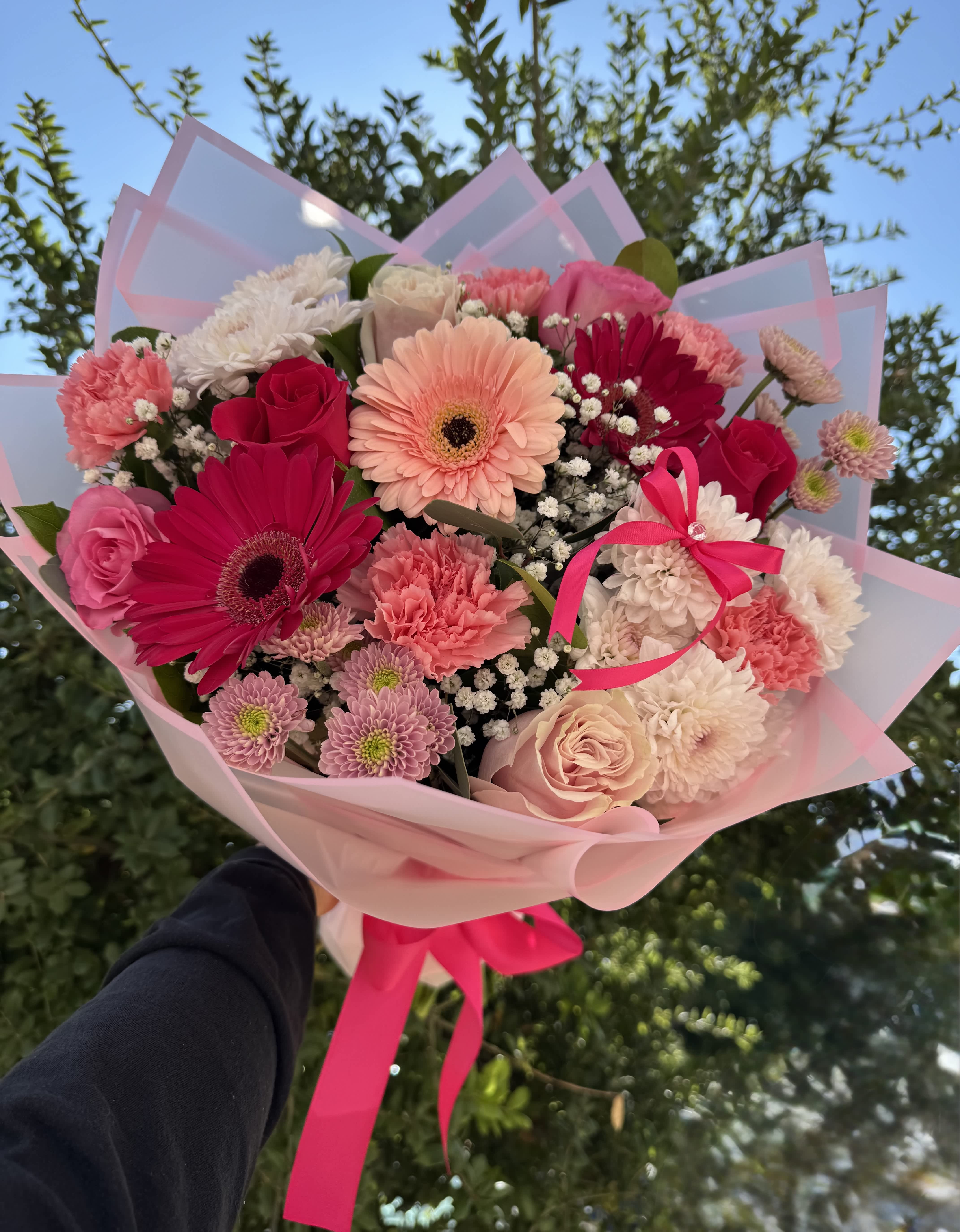 Pink and white mixed bouquet with gerbera daisies, roses, and carnations