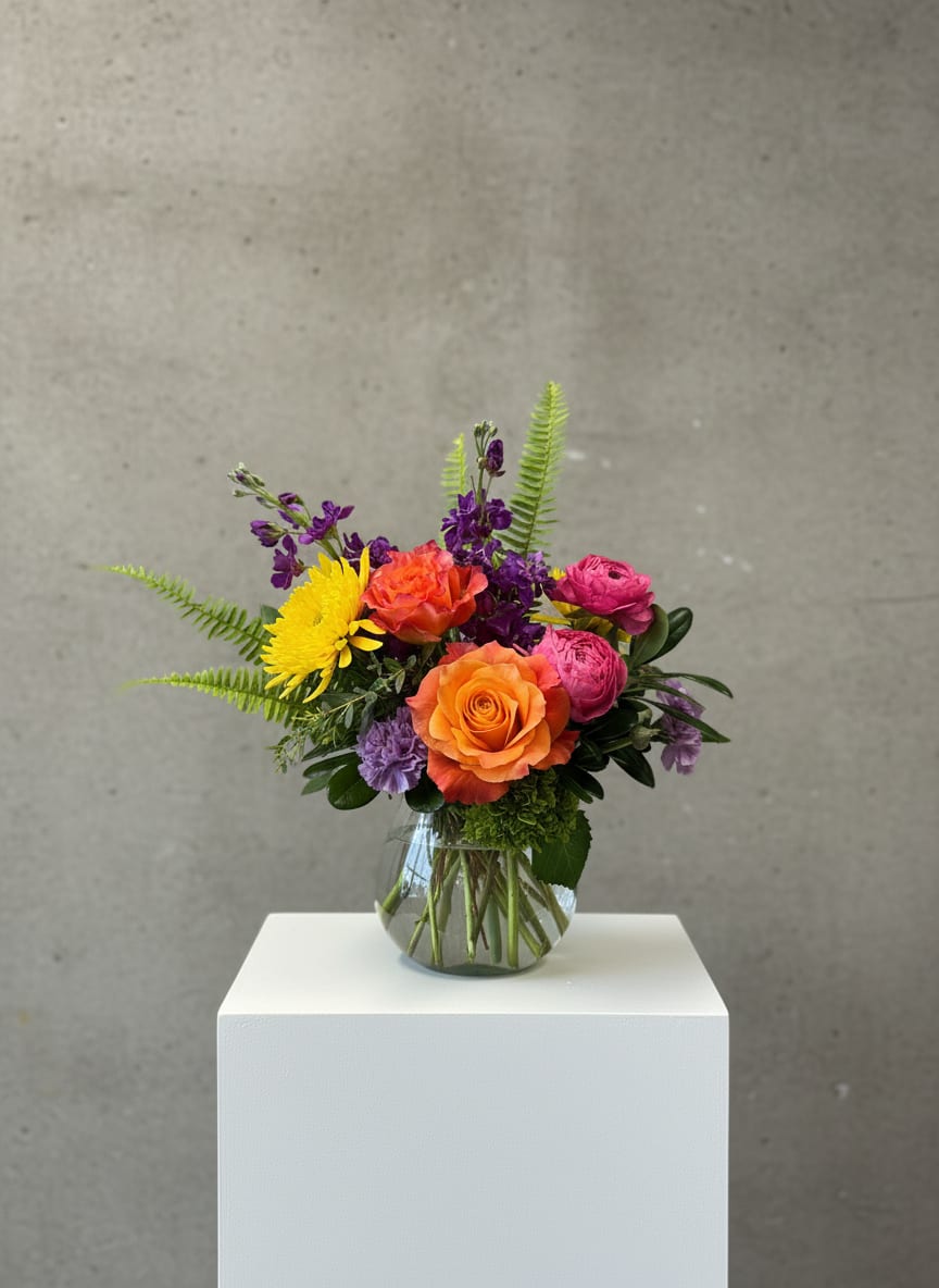Colorful mixed bouquet in a clear glass vase