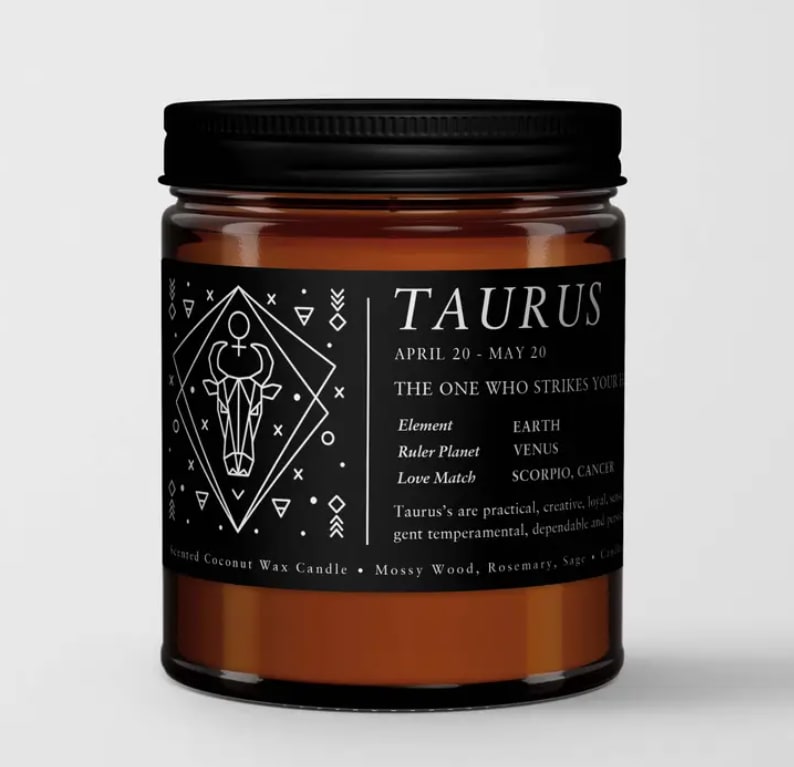 Black-labeled Taurus candle in an amber glass jar