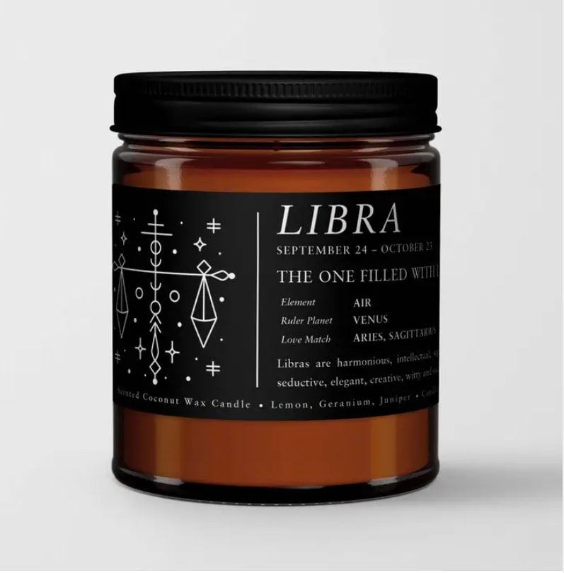 Amber candle in a black-lidded jar with a Libra label
