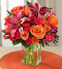 The FTD Always True Bouquet - The FTD Always True Bouquet blossoms with love's tender message. Rich red roses and carnations are accented with fuchsia mini carnations and lush greens arranged to perfection in a classic clear glass vase to create an exceptional way to convey your heart's most intimate wishes. GOOD bouquet includes 9 stems. Approx. 14"H x 10"W. BETTER bouquet includes 11 stems. Approx. 15"H x 11"W. BEST bouquet includes 14 stems. Approx. 16"H x 12"W.