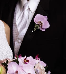FTD True Love Boutonniere - The FTDÂ® True Loveâ¢ Boutonniere is a distinctive piece blooming with  soft sophistication. A single lavender phalaenopsis bloom is accented  with variegated ivy to create the perfect look for your groomsmen.  Approx. 4âH x 3âW.  