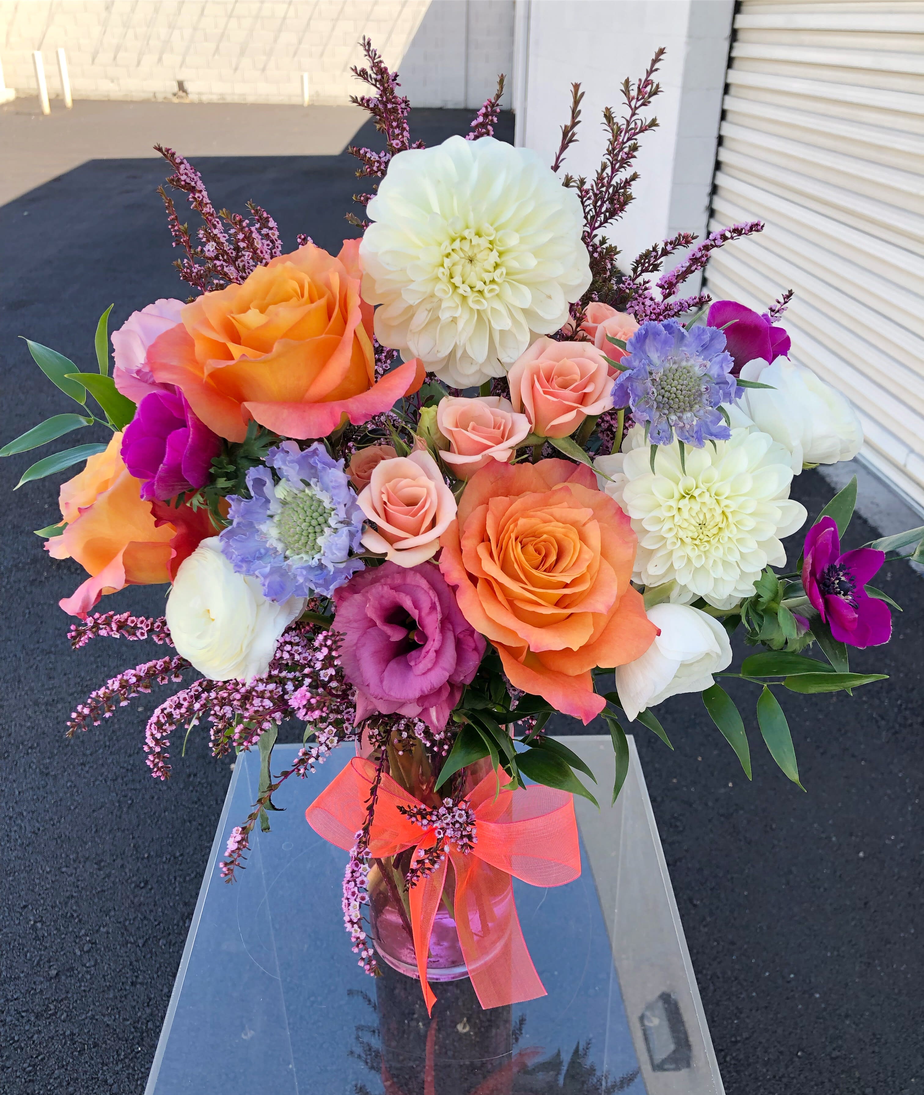 Florist's Picks- #BetterDays - DUE TO COVID-19, AVAILABILITY MAY VARY. PLEASE CALL FOR DETAILS. ALL ARRANGEMENTS WILL BE DESIGNER'S CHOICE. DELIVERY DATE AVAILABILITY IS SUBJECT TO CHANGE  Variety of premium blooms in a glass vase.  This low and lush designer's choice arrangement is hand crafted in Las Vegas by our all-women design team using the freshest high end florals from around the world. Our arrangements are created with love and delivered with care for you!