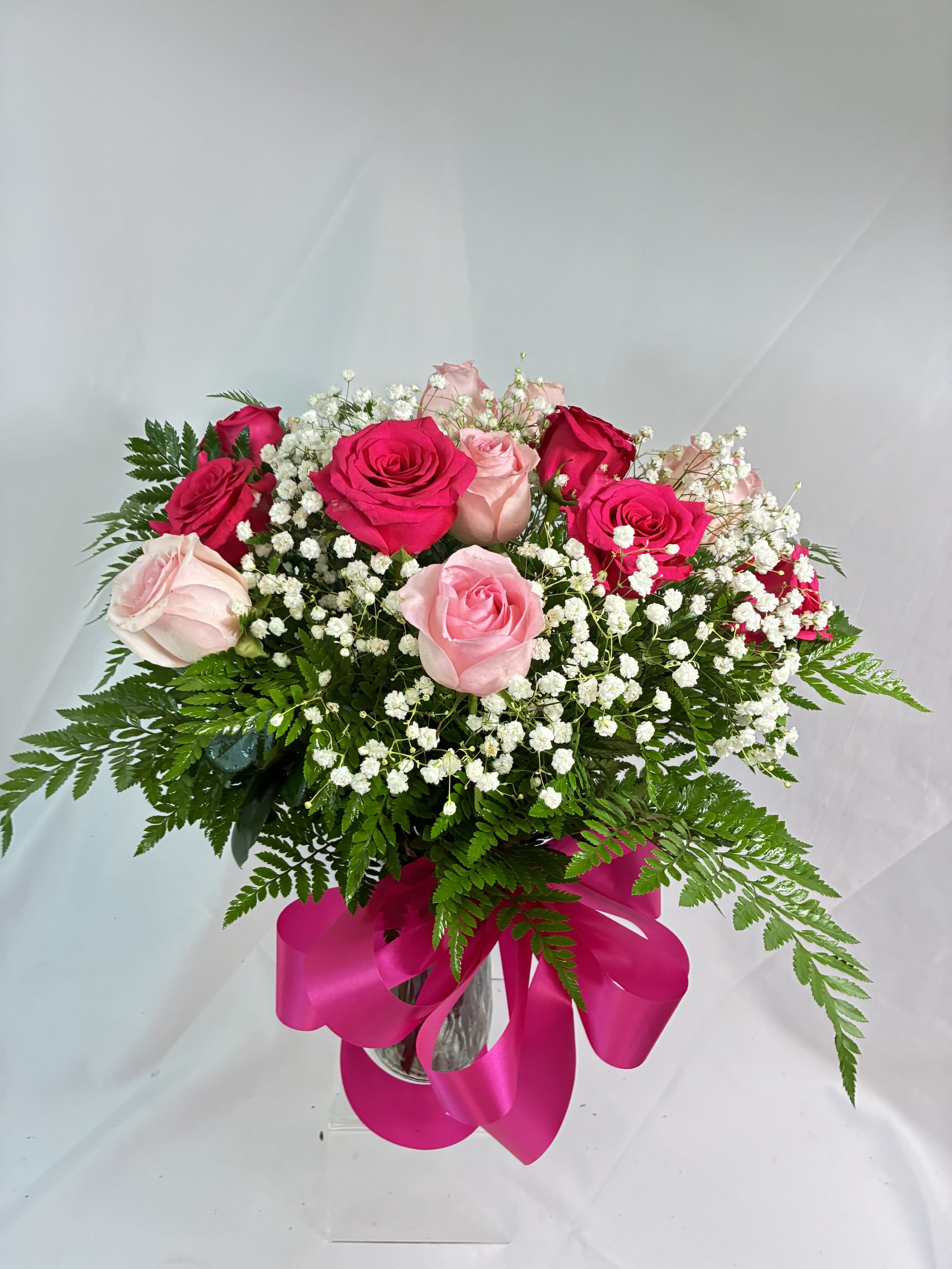 Dancing Pink Dozen Rose Bouquet - A dozen Rose arrangement that is beautiful in pinks! Such a pretty take on the classic dozen bouquet. Our large hot pink Roses with soft, beautiful lighter pink creating an absolutely happy and gorgeous classic!! Send joy in the happiest of Roses to send a big hug and smile! 