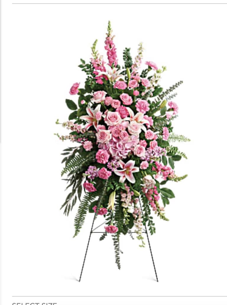 Tall pink floral standing spray on an easel