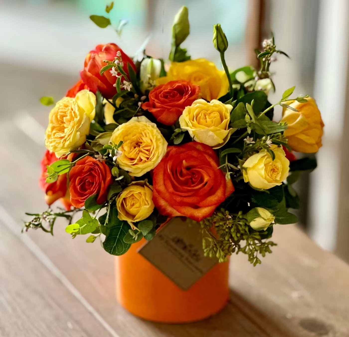 Amber   - Amber Arrangement – Bold &amp; Cheerful Florals in Warm Hues  Brighten any space with the Amber Arrangement by My Blooming Business, a top-rated florist in Los Angeles. This bold and uplifting floral display features a vibrant mix of orange and yellow seasonal blooms artfully arranged in a sleek orange ceramic vase. Perfect for all occassions, celebrations, or to simply add a burst of sunshine to someone’s day.  Highly rated on Google and Yelp, My Blooming Business proudly serves all of Los Angeles, the San Fernando Valley, and the San Gabriel Valley with same-day delivery options available.