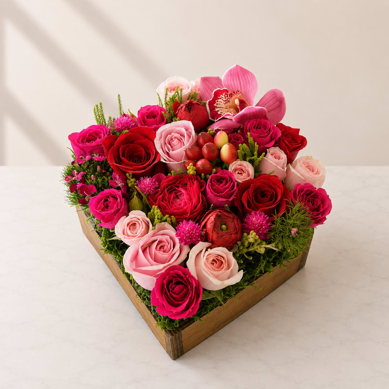Emotions  - Introducing Emotions; the perfect way to convey your deepest feelings! Our unique artisan floral boxes are filled with a Mixed bouquet of pink Roses, Spray Roses, Tulips, Cymbidium Orchids and other seasonal flowers lovingly arranged in a 7x7 brown rustic wood box. This gorgeous arrangement is designed to capture emotion and create an unforgettable impression that will last a lifetime.  