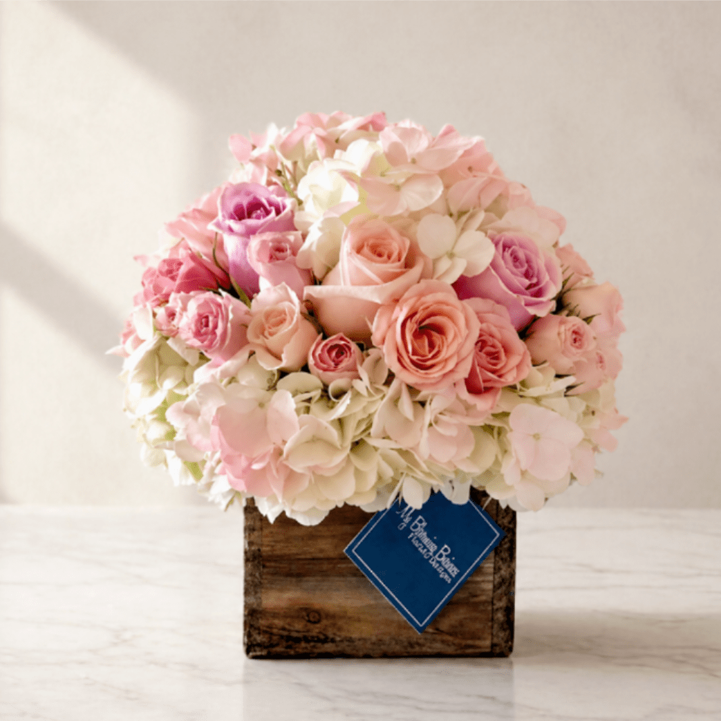 Rustic &amp; Peach – Peach Rose Floral Arrangement (Same-Day Delivery Los Angeles) - Rustic &amp; Peach – Our #1 Best Seller  Our Rustic &amp; Peach arrangement is the perfect blend of charm and elegance, making it a customer favorite for birthdays, anniversaries, thank-you gifts, sympathy, or just because. Designed in a 5x5 unfinished natural wood box, this rustic-inspired floral arrangement features lush hydrangeas paired with premium pink and peach roses and delicate spray roses for a soft, romantic look.  The warm peach tones and textured wood container create a cozy farmhouse feel that complements any home décor style — from modern cottage to classic rustic interiors.  Perfect for sending to friends, family, or loved ones for any occasion.   Details: • 5x5 unfinished wood box • Hydrangeas • Pink and peach roses • Coordinating spray roses • Rustic farmhouse style  Substitutions may occur due to seasonal availability, but we always maintain the overall color palette and premium value.  Available for local flower delivery. Order online today for fresh, handcrafted flowers designed with care. 