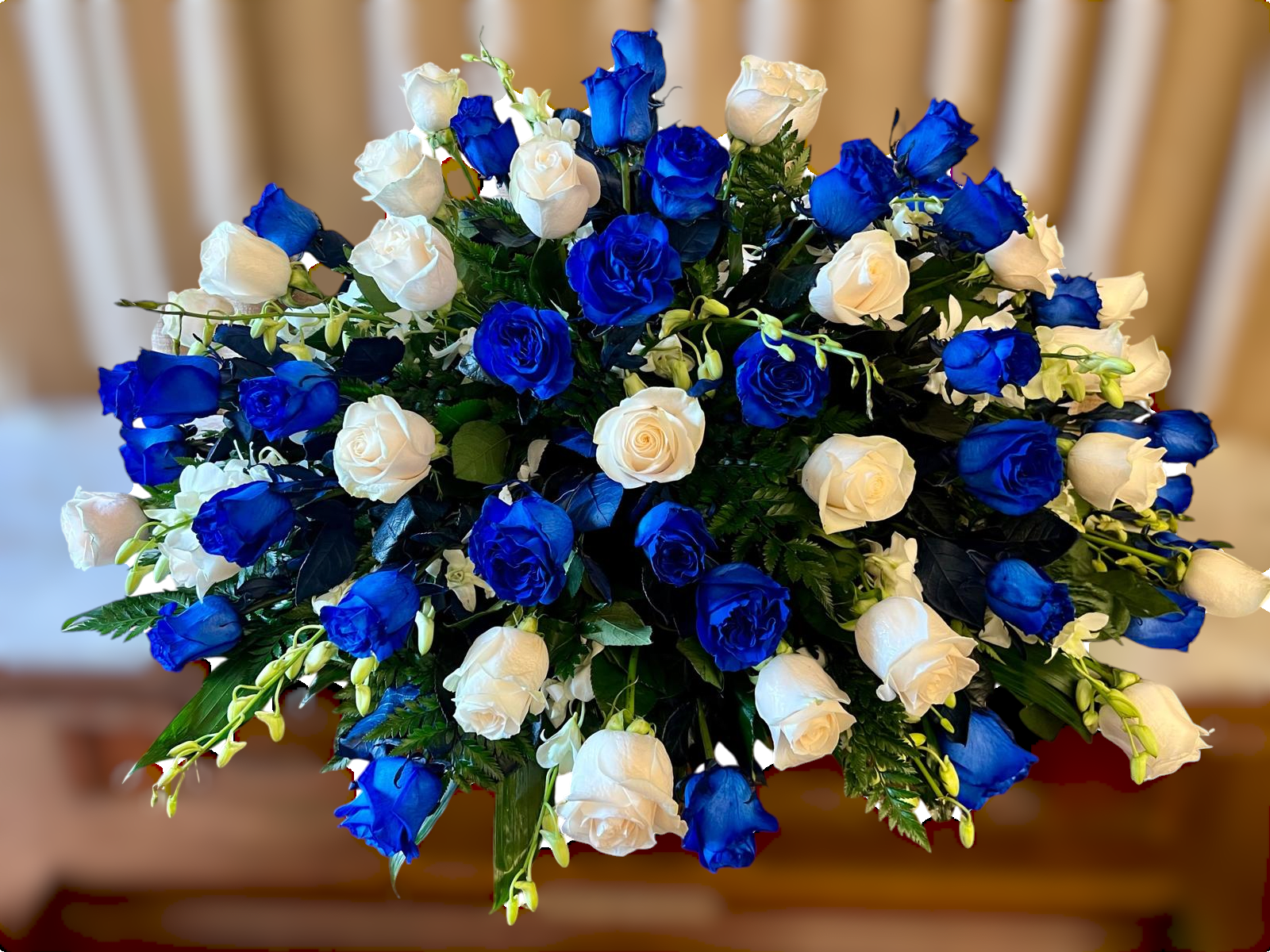 Bouquet of blue and white roses in a dense rounded arrangement