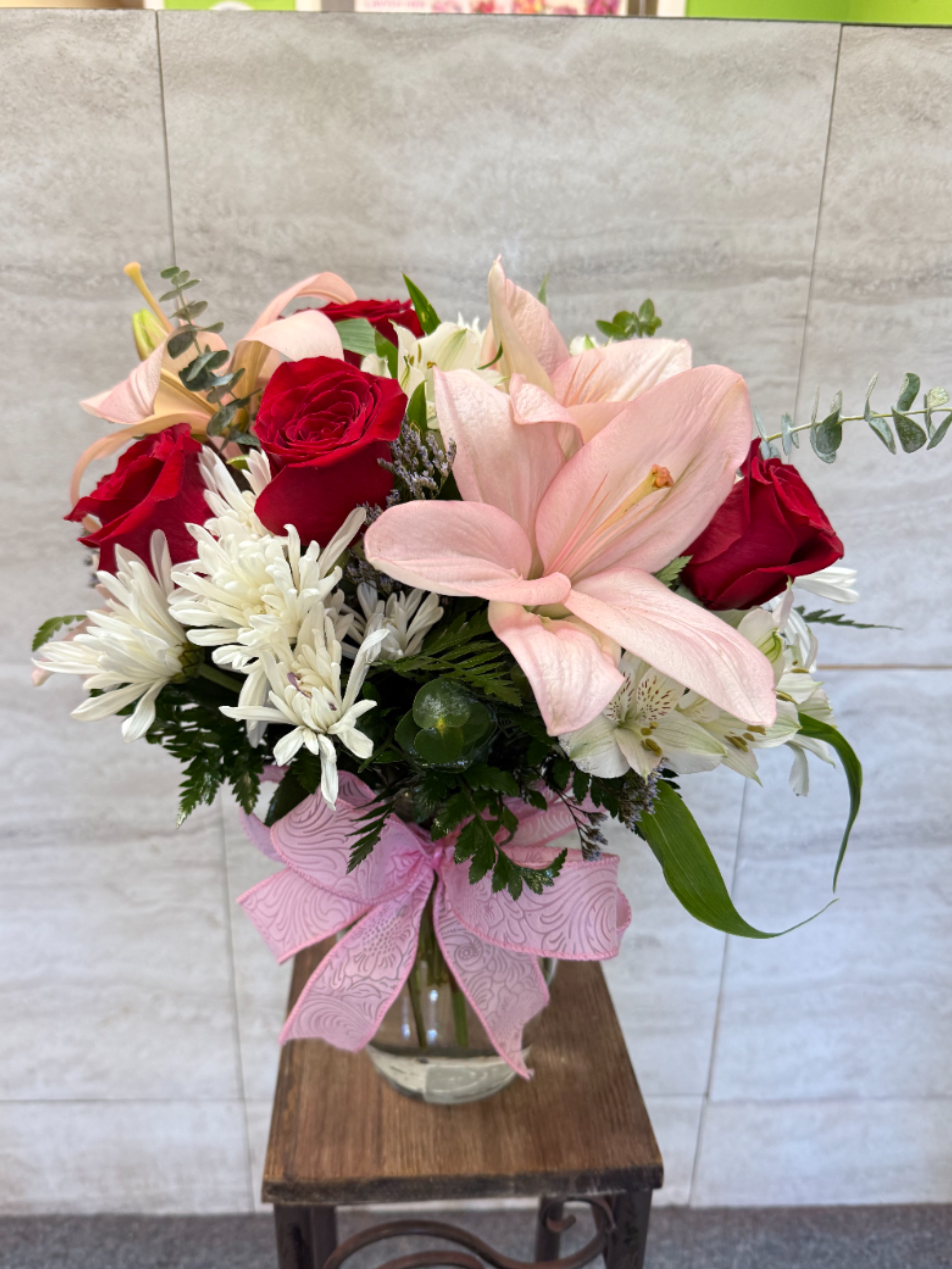 Spring Bouquet - (ALL-ROUND) Soft pink lilies, deep red roses and white chrysanthemums with lavender accents and greenery in a clear vase-romantic, cheerful spring bouquet for Mother's Day, anniversaries, birthdays or just because. 