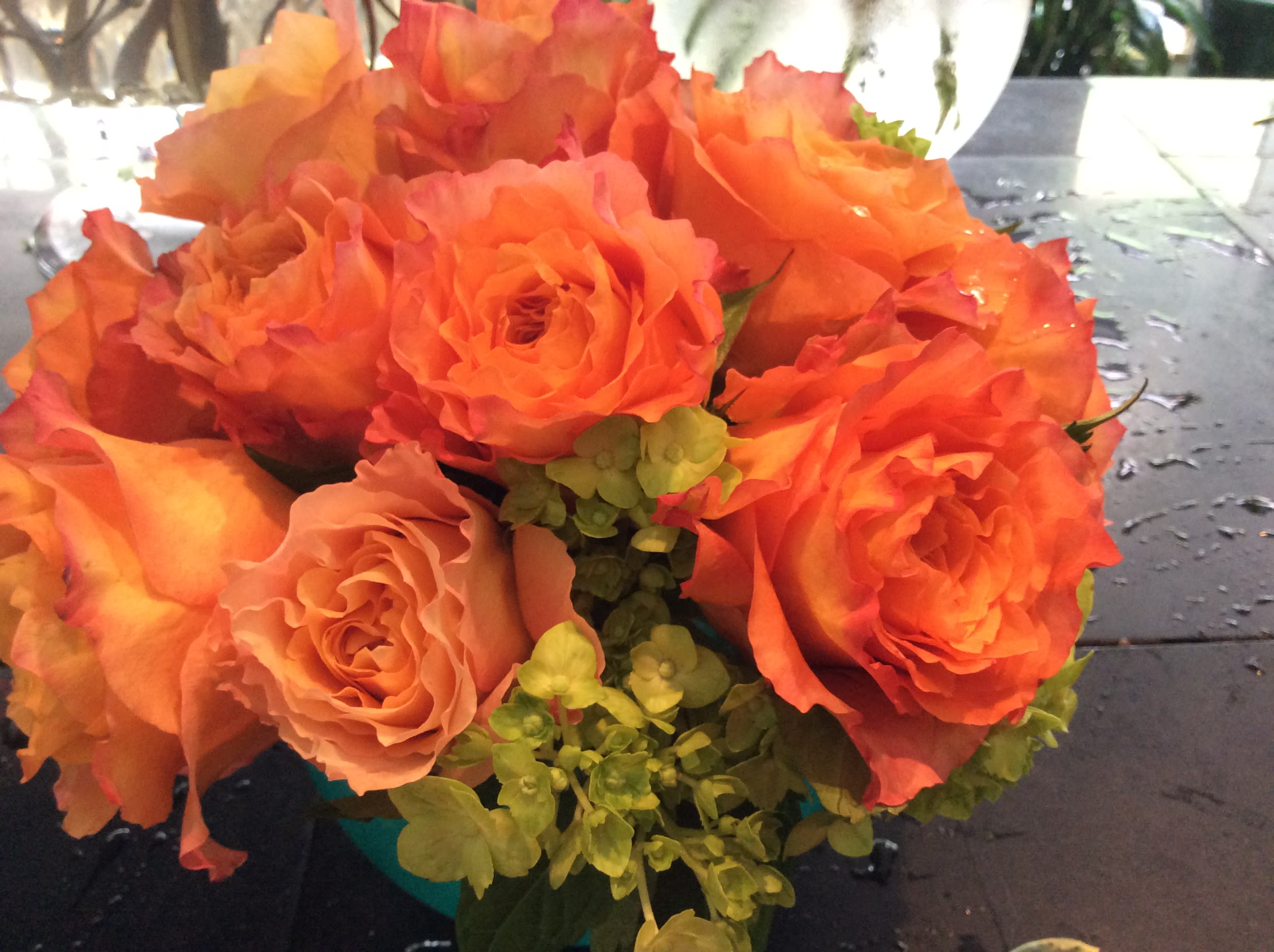 Bouquet of orange roses with green filler flowers