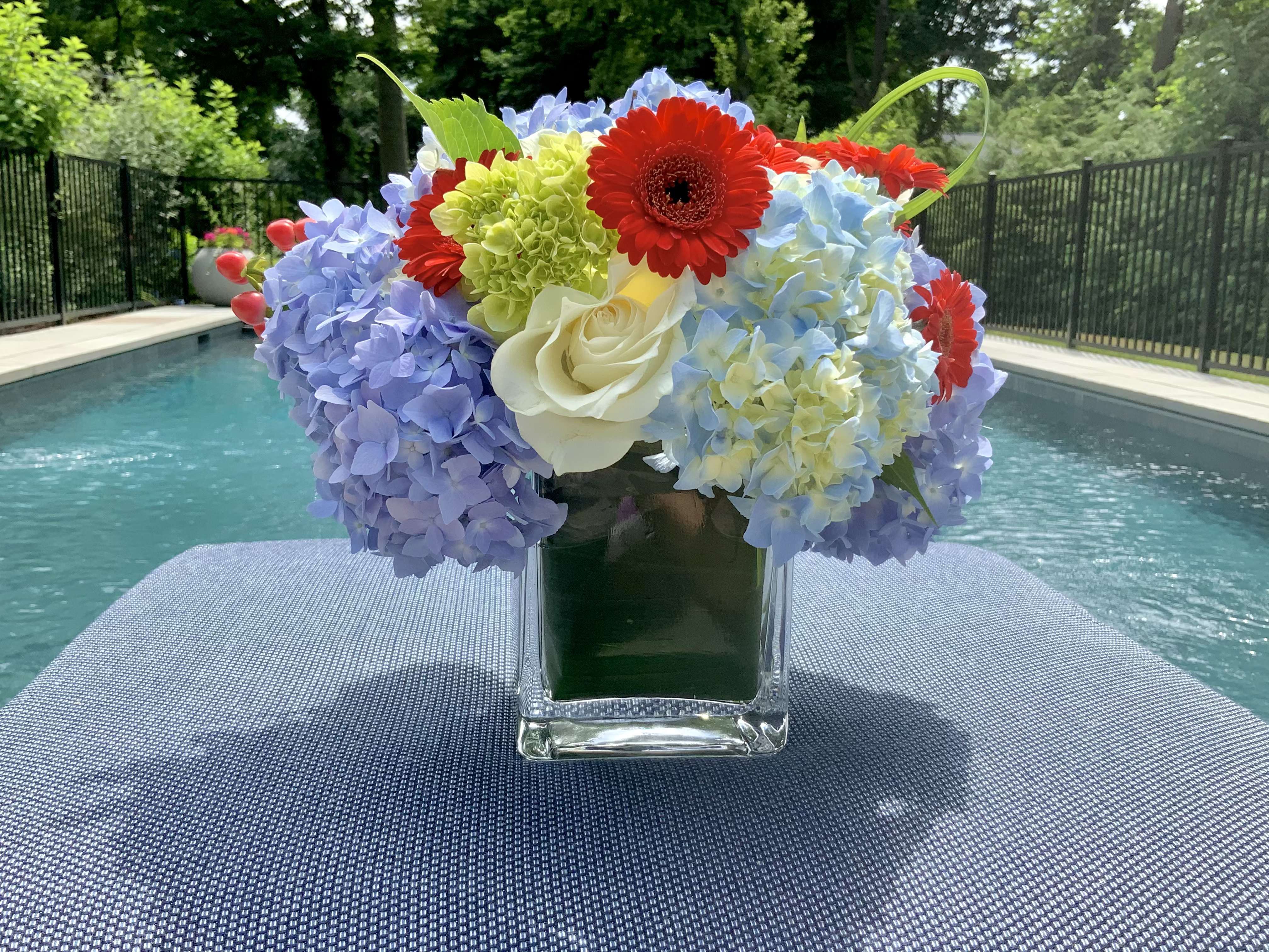 Team USA  - Reds, whites, blue ( and a kiss of green) make this lush arrangement perfect for a summer celebration!  These look so good together - consider ordering a few sizes for July 4th or any summer event.  The colors are Team USA and the flowers are as striking together as your celebrations!