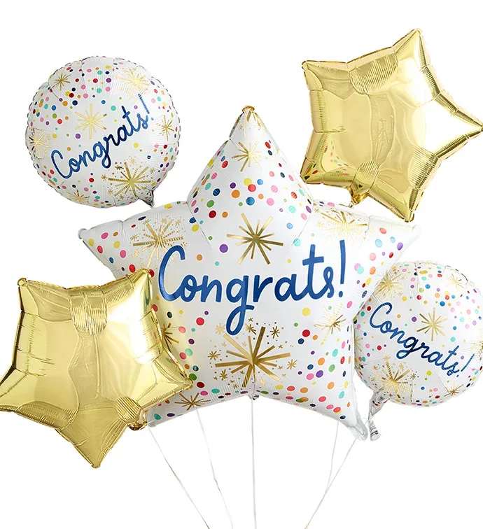 Cluster of congratulatory foil balloons in gold and white