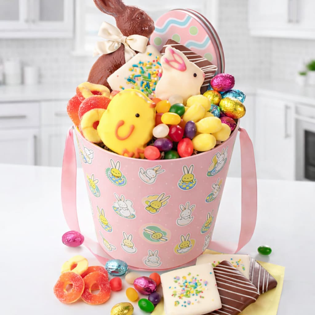 Easter Treats - Sweet treats that will delight all ages. Just the right balance yummy gummy sweets and classic ribbon wearing chocolate bunny. Details Contents: Milk Chocolate 8" Solid Easter Bunny 8 oz 2 Spring Theme Easter Cookies  Gummy Peach Rings 3 oz Gummy  3oz Milk Chocolate Foil Eggs 3 oz Spring Mix Jelly Beans 3 oz Strawberry Gummy Puffs 3 oz All packed in a Easter-Themed Container