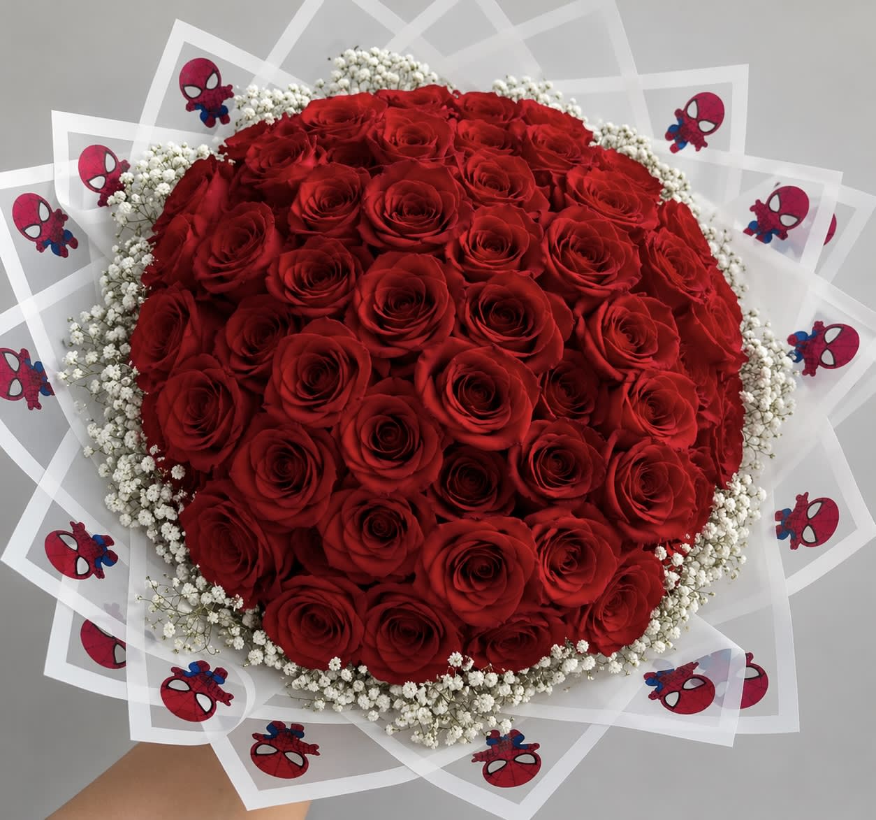 Large bouquet of red roses with white baby's breath and Spider-Man wraps