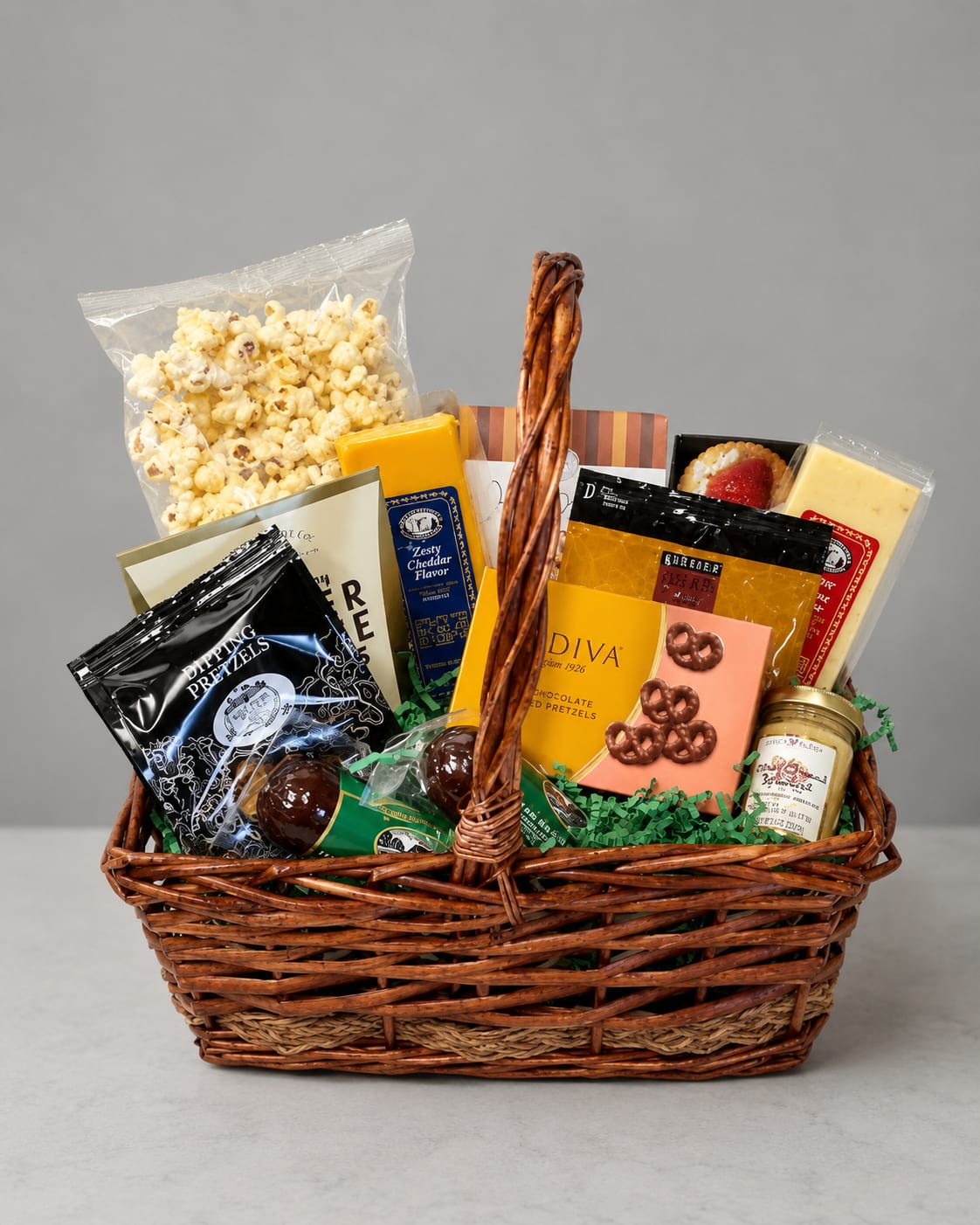 Gift basket filled with popcorn, pretzels, and packaged snacks