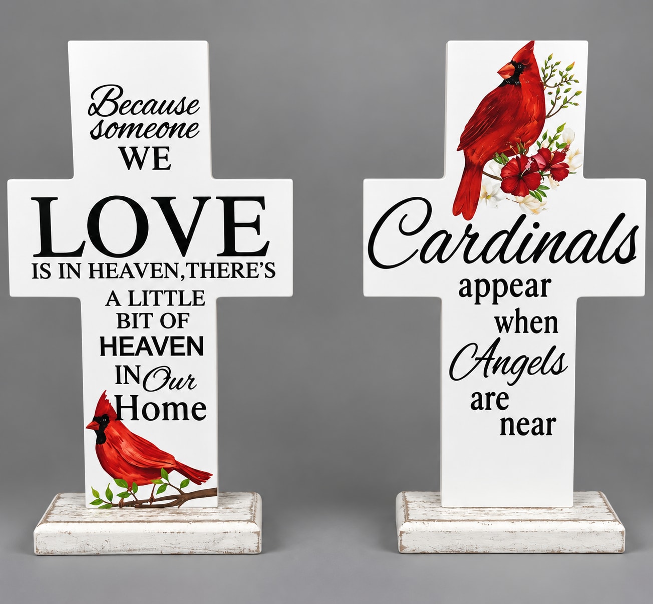 Two white memorial cross signs with cardinal and sympathy text