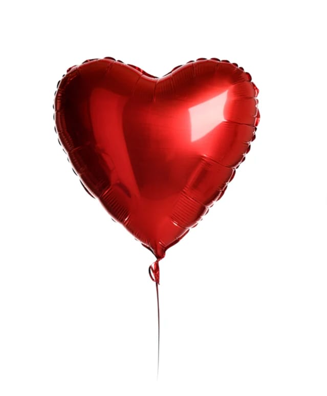 Red heart-shaped balloon on a string