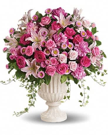 Passionate Pink Garden Arrangement - Make a grand statement with this impressive pink arrangement! Arranged in a classical urn, the pink peonies, roses, lilies and asters are a feminine, awe-inspiring tribute to the beauty of nature and true love. Lush pink, light pink and hot pink blooms including oriental lilies, matsumoto asters, roses and peonies are accented with variegated ivy and rich green salal in a classical urn.