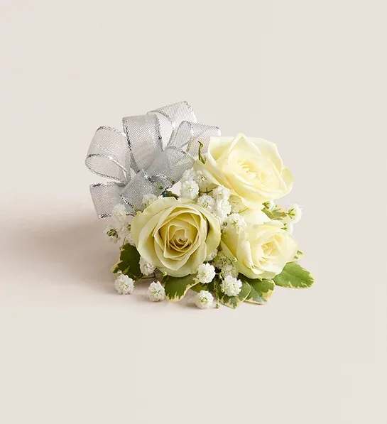 Small bouquet of cream roses with a silver ribbon