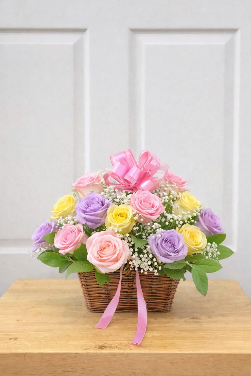 Easter Basket - A charming Easter basket arrangement featuring approximately 10 roses in soft pastel spring tones, thoughtfully designed to capture the freshness and joy of the season.