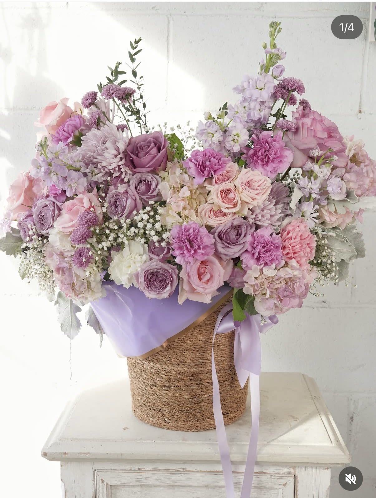 Lavender Garden Basket - A lush, pastel-filled basket that reads like a lavender-scented daydream - this large flower arrangement is perfect as a birthday bouquet, anniversary gift, or springtime surprise for someone who loves soft, romantic color. The rounded, abundant design feels celebratory and feminine; the person you're sending it to will look delighted by the gentle mix of pinks, lavenders, blush and white clustered together for maximum visual impact.  