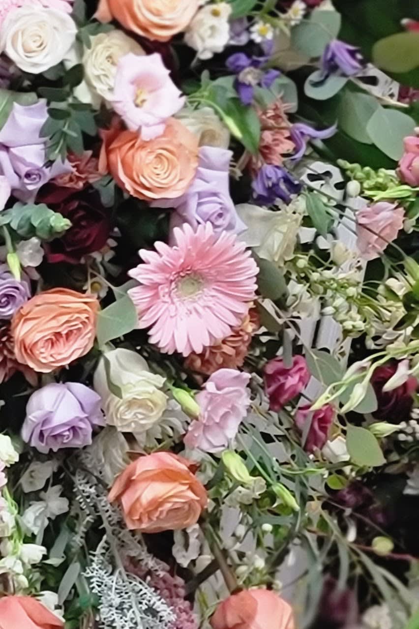 Mixed bouquet with pink, peach, and lavender flowers