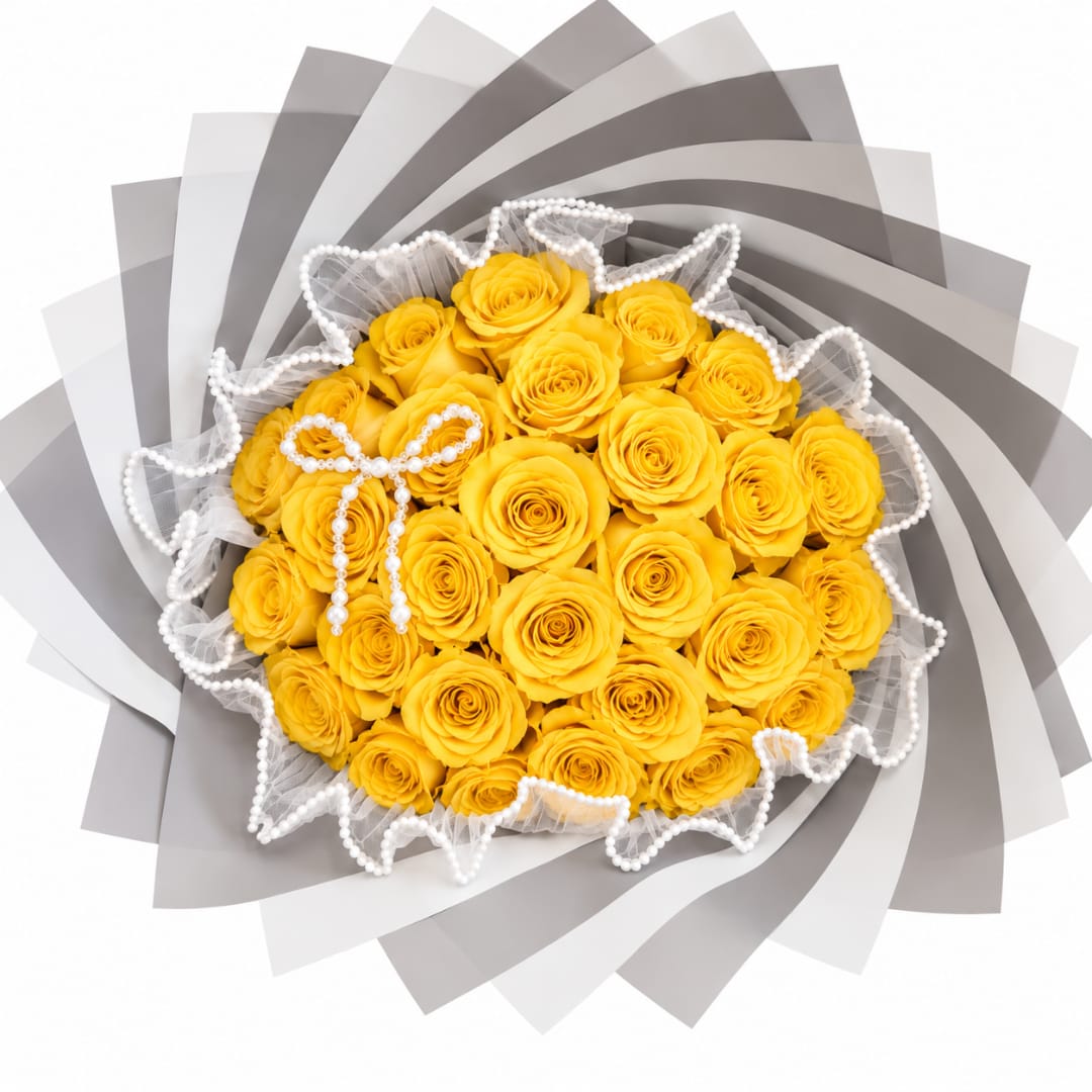 Yellow rose bouquet wrapped in gray paper with pearl trim