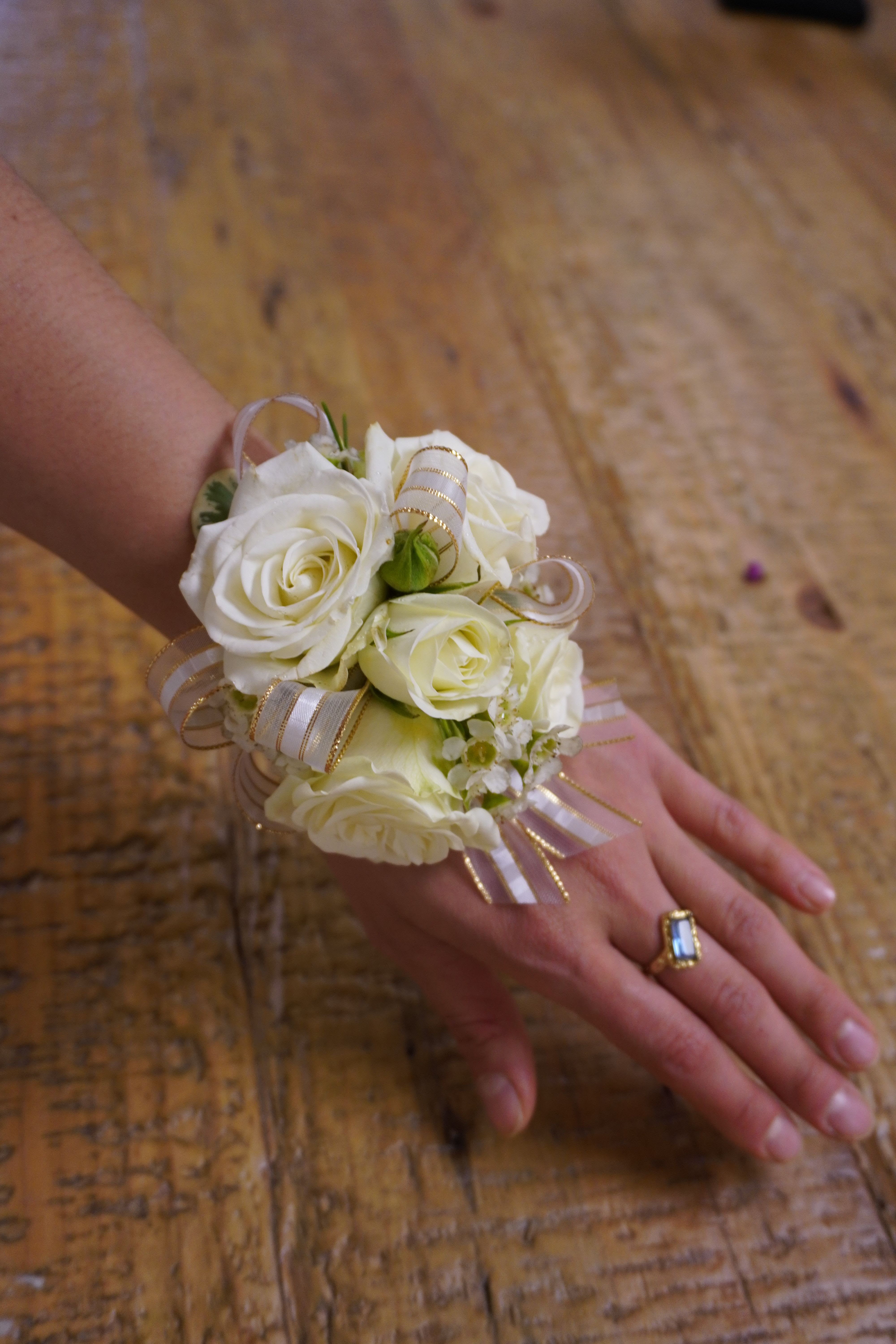 Standard Corsage - Delicately crafted corsages made with fresh mini roses, filler, small touches of greenery, &amp; ribbon. Customize the colors to your liking. Keep it simple or upgrade with pearls, crystals, &amp;/or elegant wrist bands. *Provide corsage details at checkout*