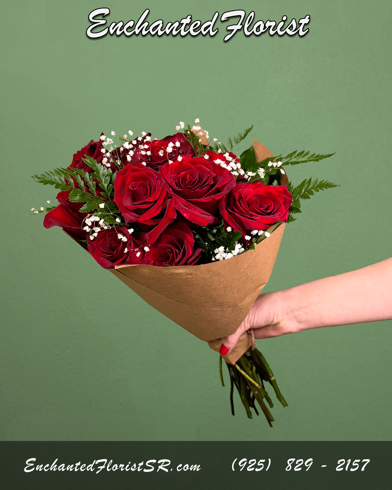 Handheld bouquet of red roses wrapped in brown paper against a green background