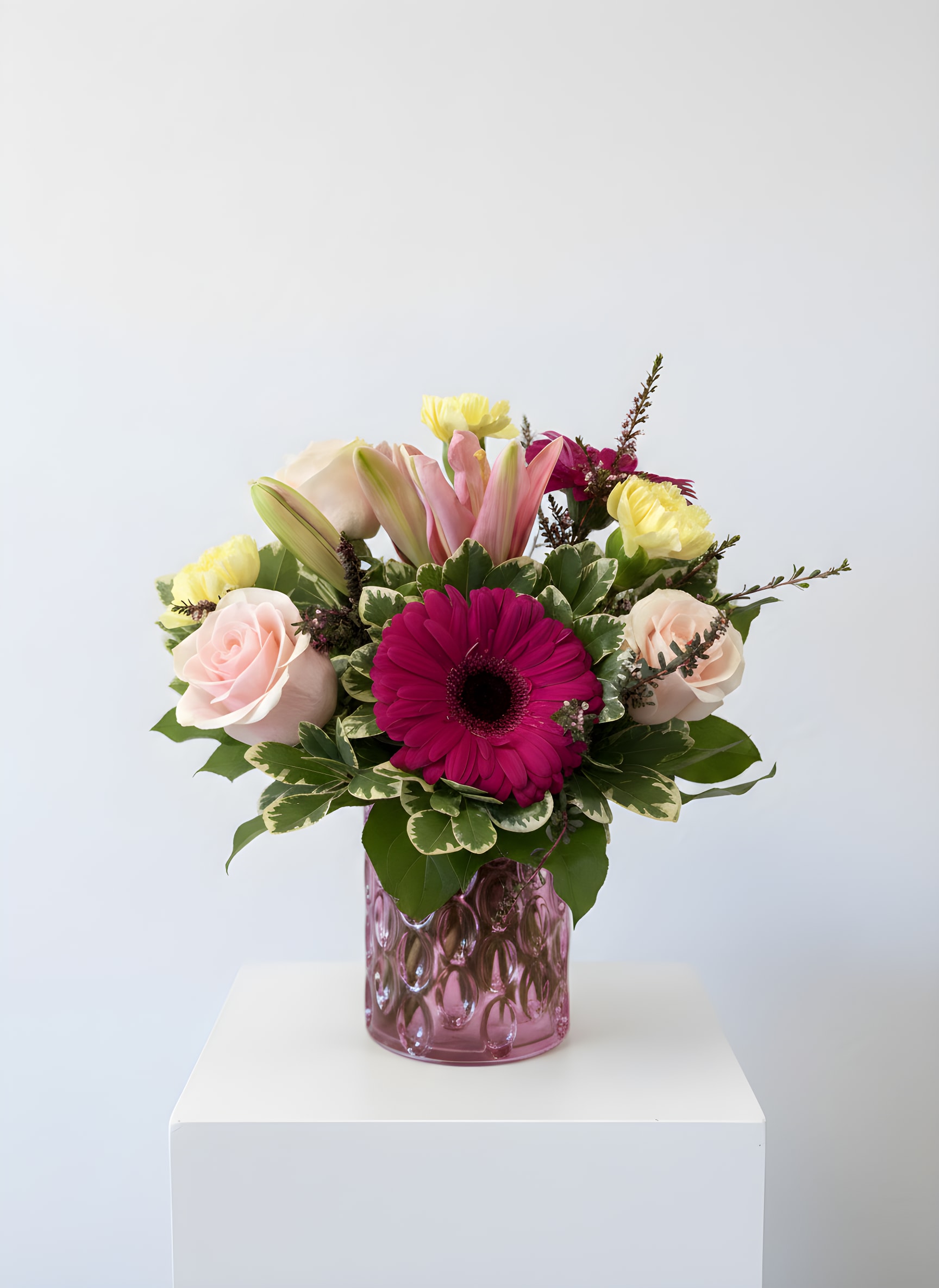 Roselle - Roselle is a charming floral arrangement designed in a keepsake pink 5x4 cylinder vase and filled with premium blush roses, fragrant pink lilies, vibrant fuchsia gerbera daisies, carnations, and lush seasonal greenery. Featuring soft pastel tones with rich pops of pink, Roselle brings beauty and elegance to any occasion.  Handcrafted by the designers at All Occasions Florist in Dallas, Texas, Roselle is a beautiful choice for birthdays, anniversaries, thank you gifts, get well wishes, new baby celebrations, or simply brightening someone's day. Its compact size makes it perfect for homes, offices, hospital rooms, and bedside tables.  All Occasions Florist proudly offers same-day flower delivery throughout Dallas, Highland Park, University Park, Uptown, Oak Lawn, Preston Hollow, and surrounding communities. Whether you're sending flowers to a loved one, a Dallas hotel, hospital, or special event, Roselle delivers fresh blooms and heartfelt sentiment.  Flower varieties may vary slightly based on seasonal availability while maintaining the overall style, color palette, and beauty of the arrangement.