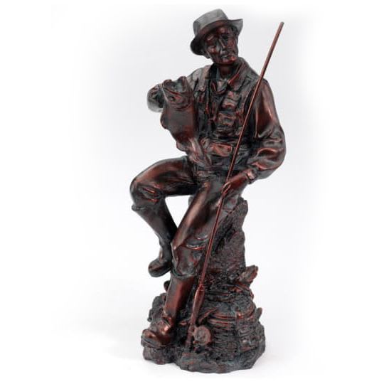 Dark brown figurine of a seated fisherman holding a large fish and fishing rod