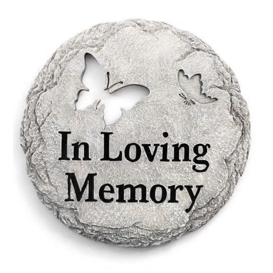 Round gray memorial stone with butterfly cutouts and the words In Loving Memory