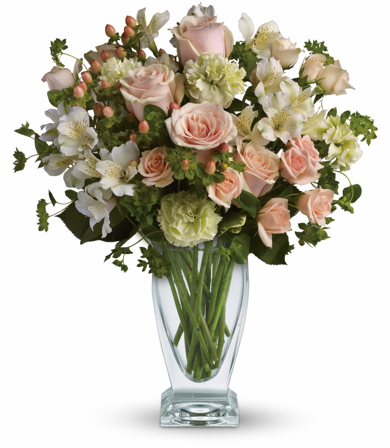 Vase arrangement of peach roses, green carnations, and white alstroemeria in a clear glass vase