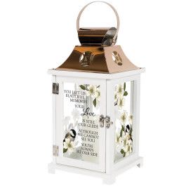 White memorial lantern with gold top, printed white blossoms, bird art, and sympathy verse on glass panels.