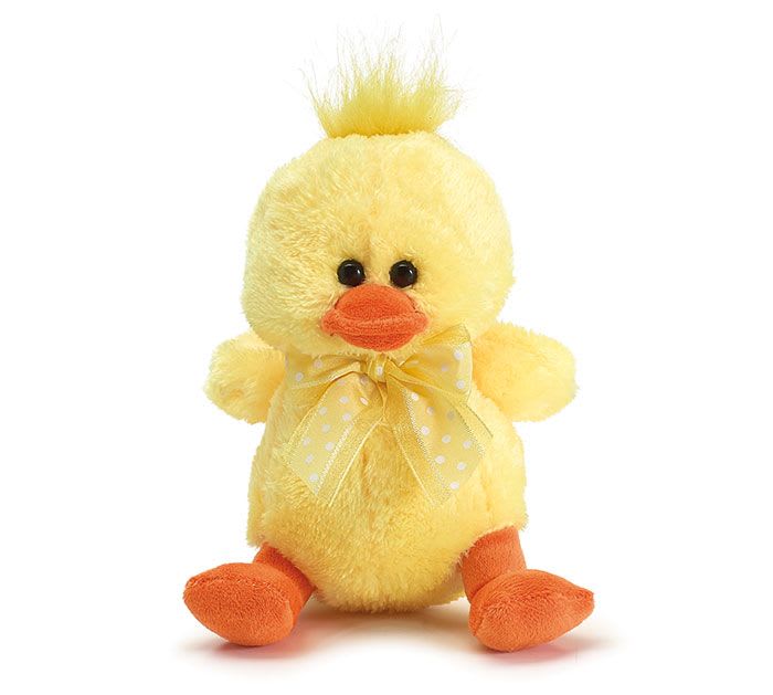 Small yellow plush duck with orange beak and feet and a yellow polka dot bow